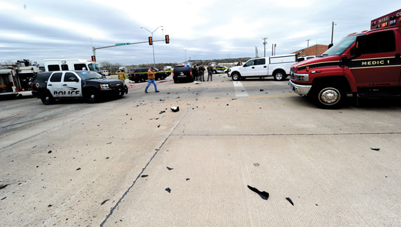 TOTAL CARNAGE - After Evan S. Ebel rammed a car into the side of a rock hauler, shattered glass and parts of the 1991 Cadillac spilled across the intersection of U.S. 380 and U.S. West Business 380. Messenger photo by Joe Duty