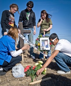 CLASSES CROSS - After Chelsea Lunt's death, her classmates created a shrine where the wreck that killed her occured. The memorial included a cross and other items to honor her memory. Messenger photo by Joe Duty
