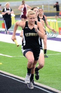 DOWN THE STRETCH - Alvord's Ariel Rogers finished off a convincing win for the Lady Bulldogs in the mile relay. Messenger photo by Mack Thweatt