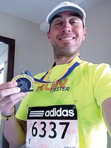 MOMENTS BEFORE - Prior to Boston Marathon bombing Thomas Aaberg snaps photo with medal in hotel room. Submitted photo