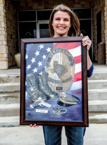 REMEMBERING RANDY - On the four-year anniversary of his death, Janet White presented the Bridgeport Police Department with a pastel painting of objects that represented her husband, Sgt. Randy White, as a police officer. Sgt. White was killed in the line of duty on April 2, 2009. Messenger photo by Joe Duty