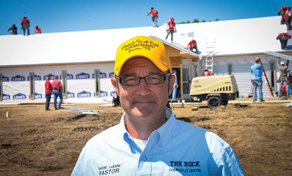 VISION BECOMES REALITY - The Rock Church in Justin Pastor Shane LeJeune helped lead hundreds of volunteers last Friday to build the church's first permanent home all in one day. Messenger photo by Joe Duty