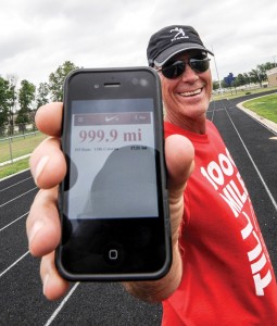 ALMOST THERE - Wendell Berry Jr. grins after running 4.9 miles at the Decatur track Monday. It brought him within one-tenth of a mile of his 1,000-mile goal and fundraising quest. He'll run the last 10th in the arena at the J.W. Hart PBR Challenge Saturday, June 8. Messenger photo by Joe Duty