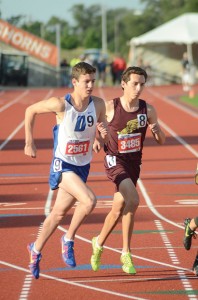 LONG DAY - Decatur's Taylor Clayton rounds the corner in the 3200 meter Saturday. He came back later that night to compete in the 1600 meter. Messenger photo by Mack Thweatt
