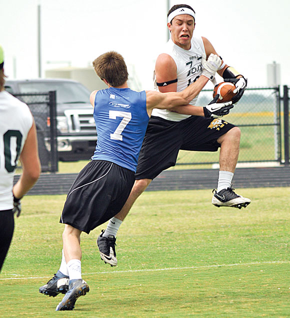 NICE GRAB - Boyd's Chris Carmona makes the catch as Decatur's Cory Durdon defends during 7-on-7 at Decatur Thursday. Messenger photo by Kelly Guess