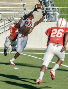 NICE GRAB - Northwest's Emmanuel Moore makes a catch across the middle Wednesday during the Texans' annual spring game at Northwest ISD Stadium. Messenger photo by Joe Duty
