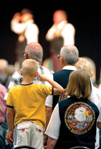 PAYING TRIBUTE - A little boy salutes veterans at a past Memorial Day celebration in Decatur. Messenger photo by Joe Duty