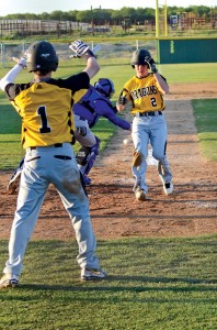 SPRINT FOR HOME - Chico's Hunter Clarke waves home Kalan Johnson during the Dragons game one victory. Messenger photo by Mack Thweatt