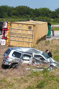ROLLED - An 18-wheeler came to rest on its side Tuesday afternoon after colliding with a gray Chevy SUV on U.S. 287 north of Alvord. The truck driver was not injured, but the SUV's driver died at the scene. Messenger photo by Jimmy Alford