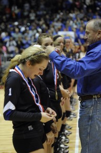 Superintendent Rod Townsend presents the Decatur Lady Eagles with their medals after winning the Class 3A state volleyball championship Saturday. Messenger photo by Joe Duty