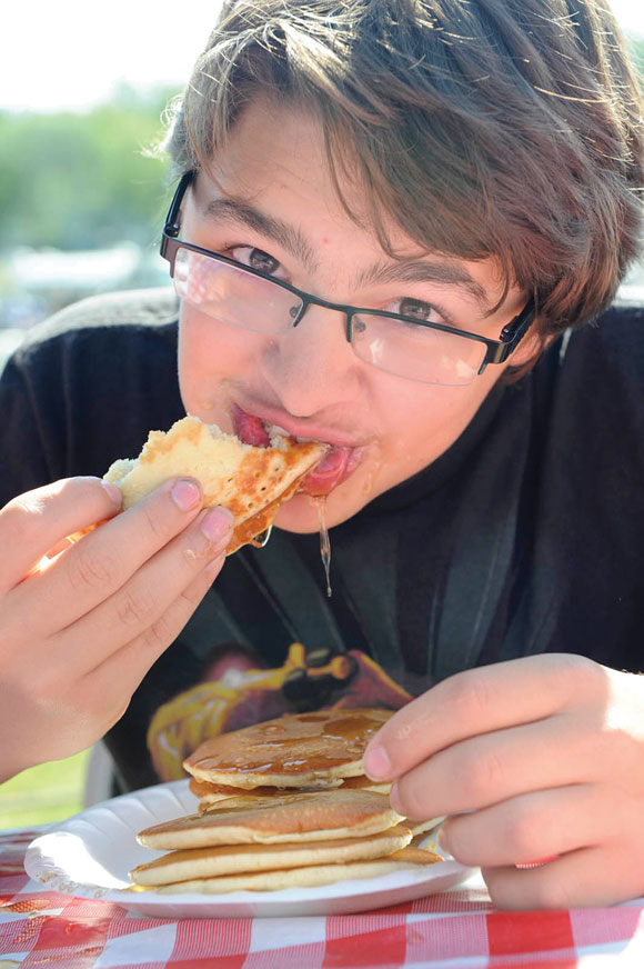 Justin Massey at a pancake eating contest at Butterfield State Days. Messenger photo by Joe Duty