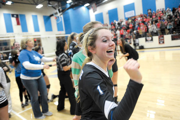 Decatur volleyball player Stormi Leonard celebrates a playoff win. Messenger photo by Joe Duty