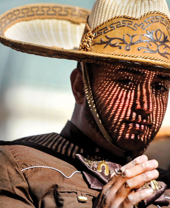 UNDER THE SOMBRERO - The sun casts intricate shadows across the face of a charro during Saturday's stock show parade in Fort Worth. Messenger photo by Joe Duty