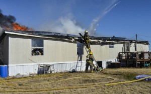 Firefighters from Decatur, Rhome and East Wise responded to a house fire in the 100 block of Private Raod 4435 Wednesday morning. Photo by Joe Duty.