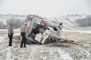 A one-ton truck hauling heavy equipment on U.S. 287 just north of Decatur was one of dozens of accidents due to the snow and sleet storm Sunday. Photo by Joe Duty.
